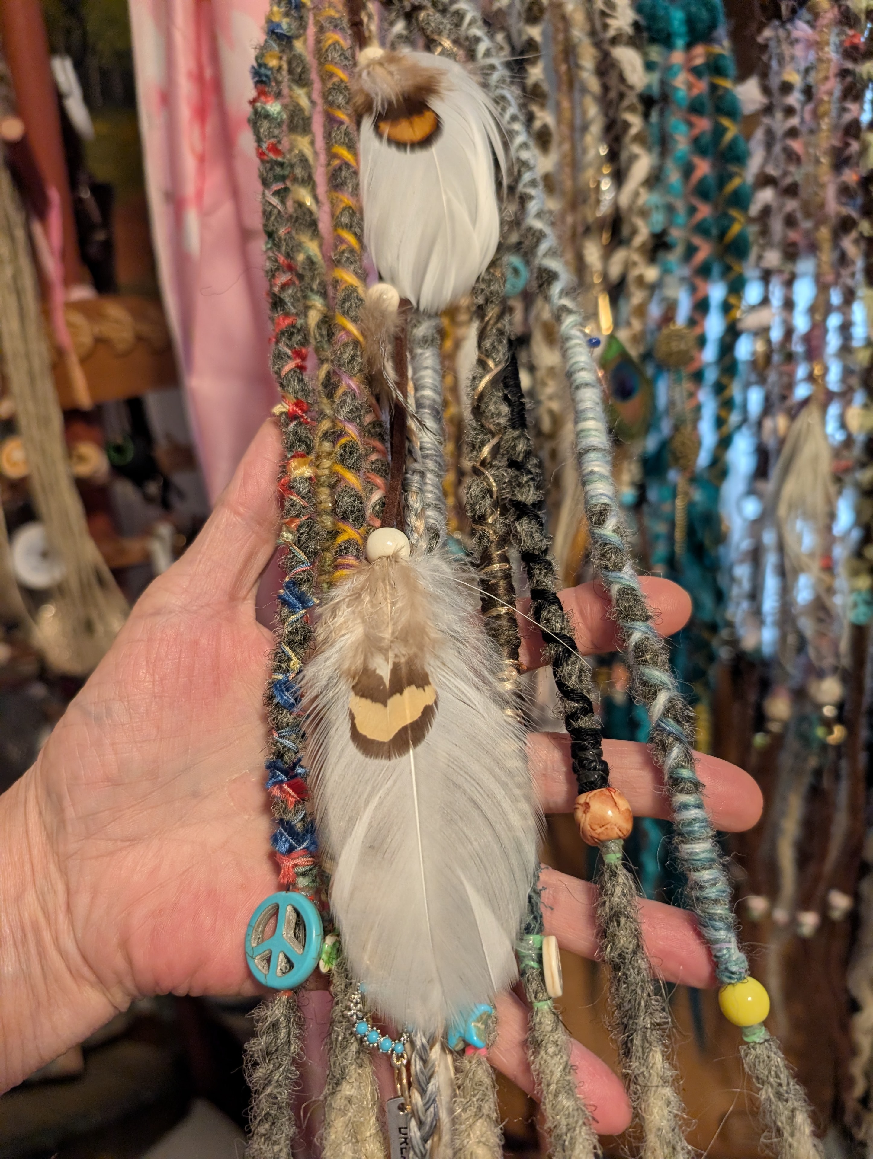 Textured Sista Dreads accessory with feathers
